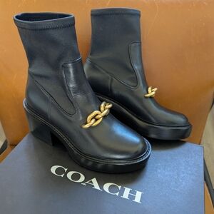 Coach Black Heeled Boots with Gold Chain Accent